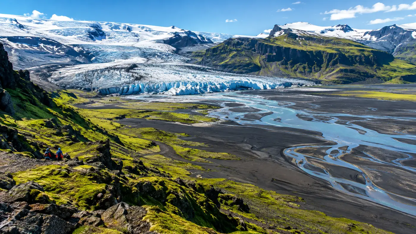 Aerial view of the edge of the Vatnajökull ice cap breaking into crevassed outlet glaciers